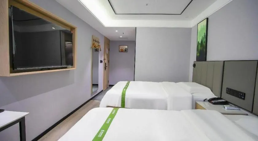 Bed in GreenTree Inn LiaoCheng LinQing HaiShan Building Express Hotel