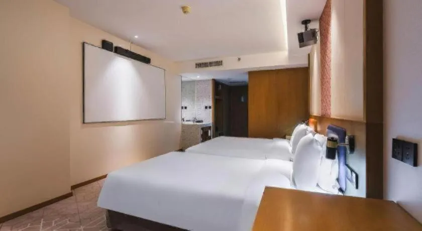 Bed in Gtel Rock City Qingdao Hotel