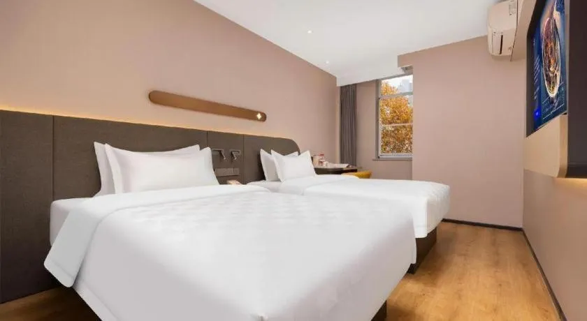 Bed in Jinjiang Inn Henan Museum Hutun Metro Station