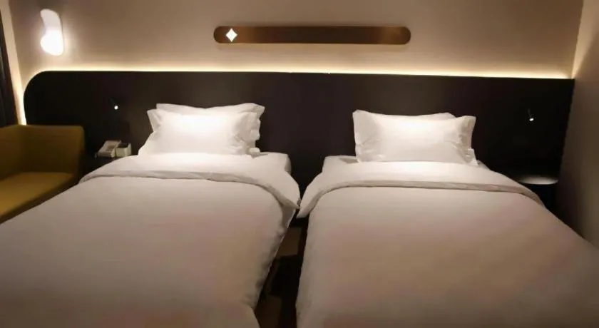 Bed in Jinjiang Inn Henan Museum Hutun Metro Station