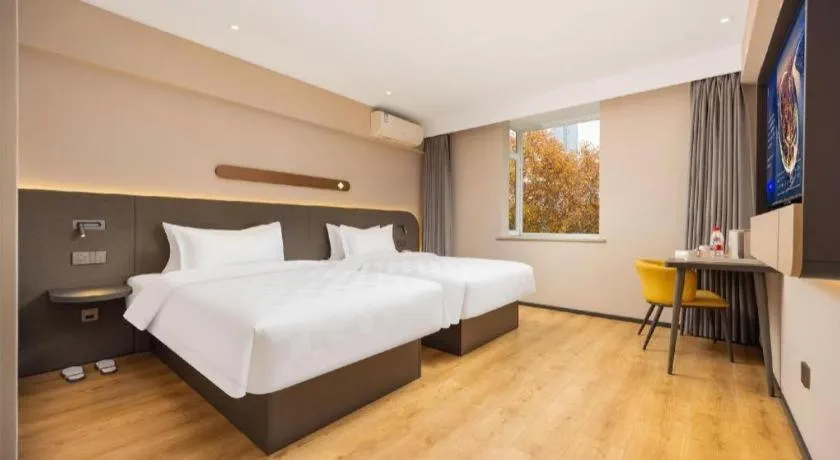 Bed in Jinjiang Inn Henan Museum Hutun Metro Station