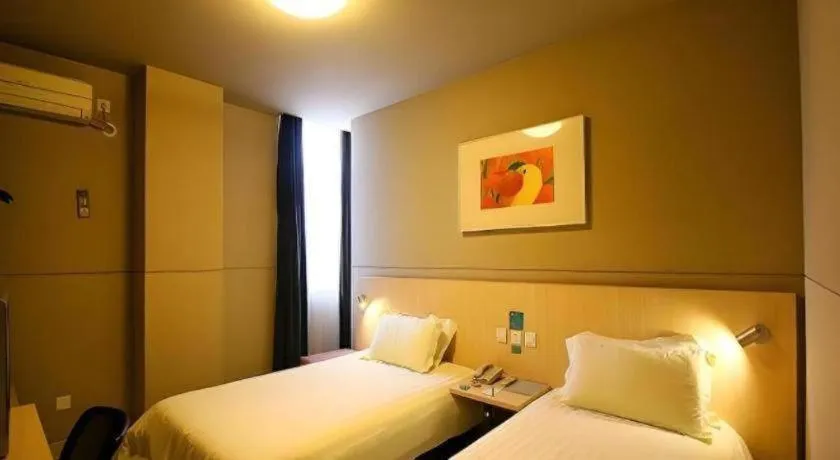Bed in Jinjiang Inn Changzhou Global Dinosaur City Olympic Center
