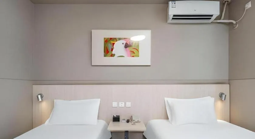 Bed in Jinjiang Inn Changzhou Global Dinosaur City Olympic Center