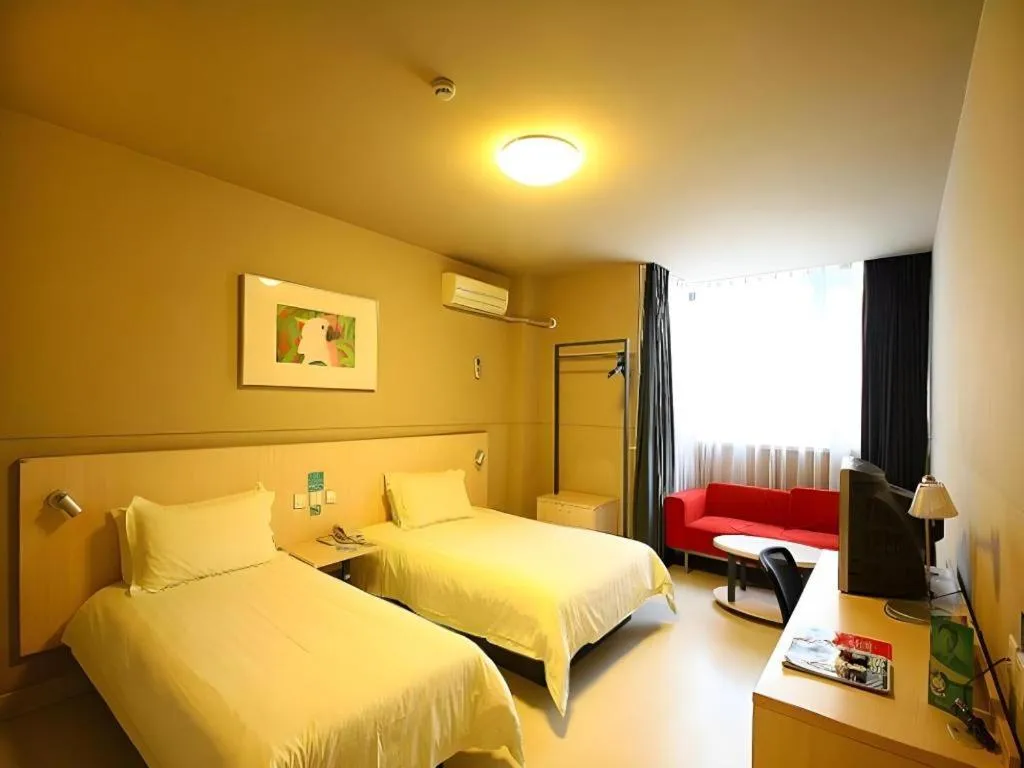 Bed in Jinjiang Inn Changzhou Global Dinosaur City Olympic Center