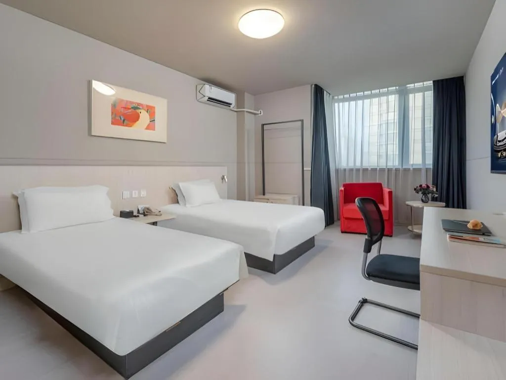 Bed in Jinjiang Inn Changzhou Global Dinosaur City Olympic Center