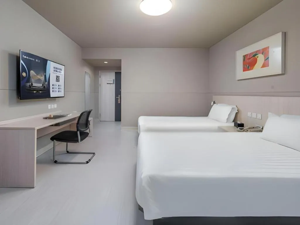 Bed in Jinjiang Inn Changzhou Global Dinosaur City Olympic Center