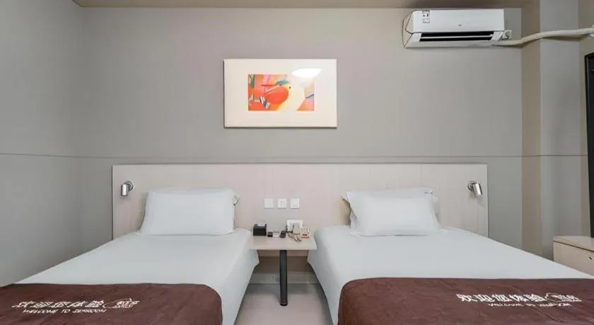 Bed in Jinjiang Inn Changzhou Global Dinosaur City Olympic Center