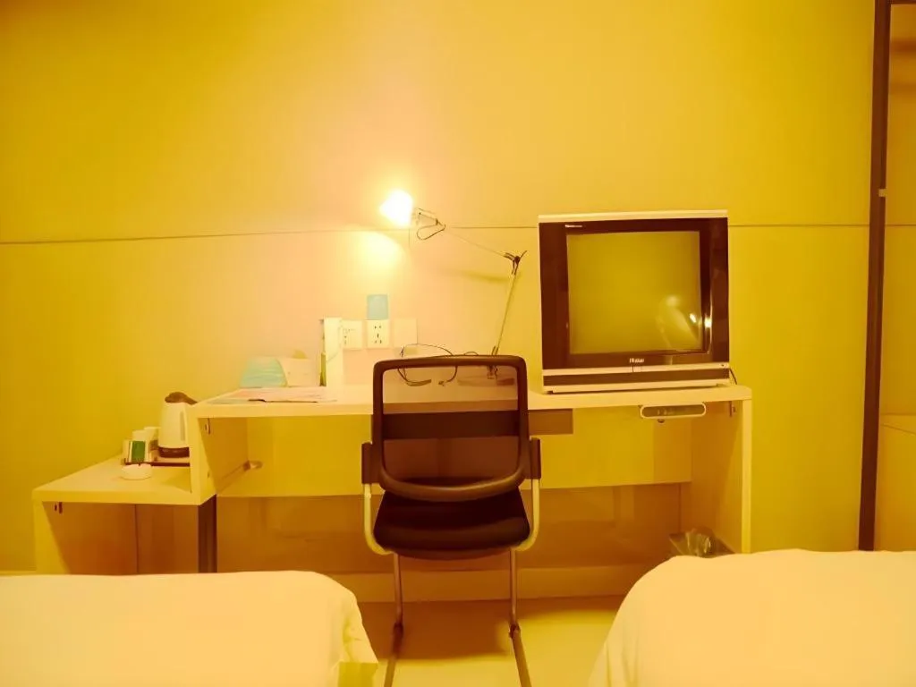 Bed in Jinjiang Inn Changzhou Global Dinosaur City Olympic Center