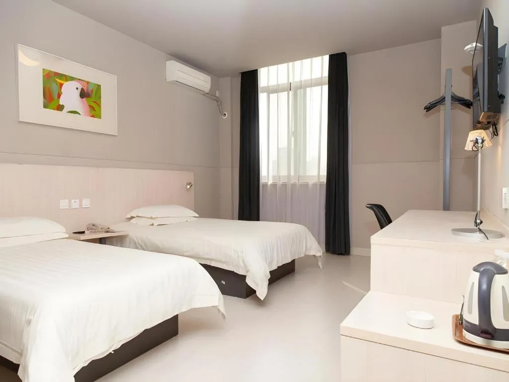 Bed in Jinjiang Inn Changzhou Global Dinosaur City Olympic Center