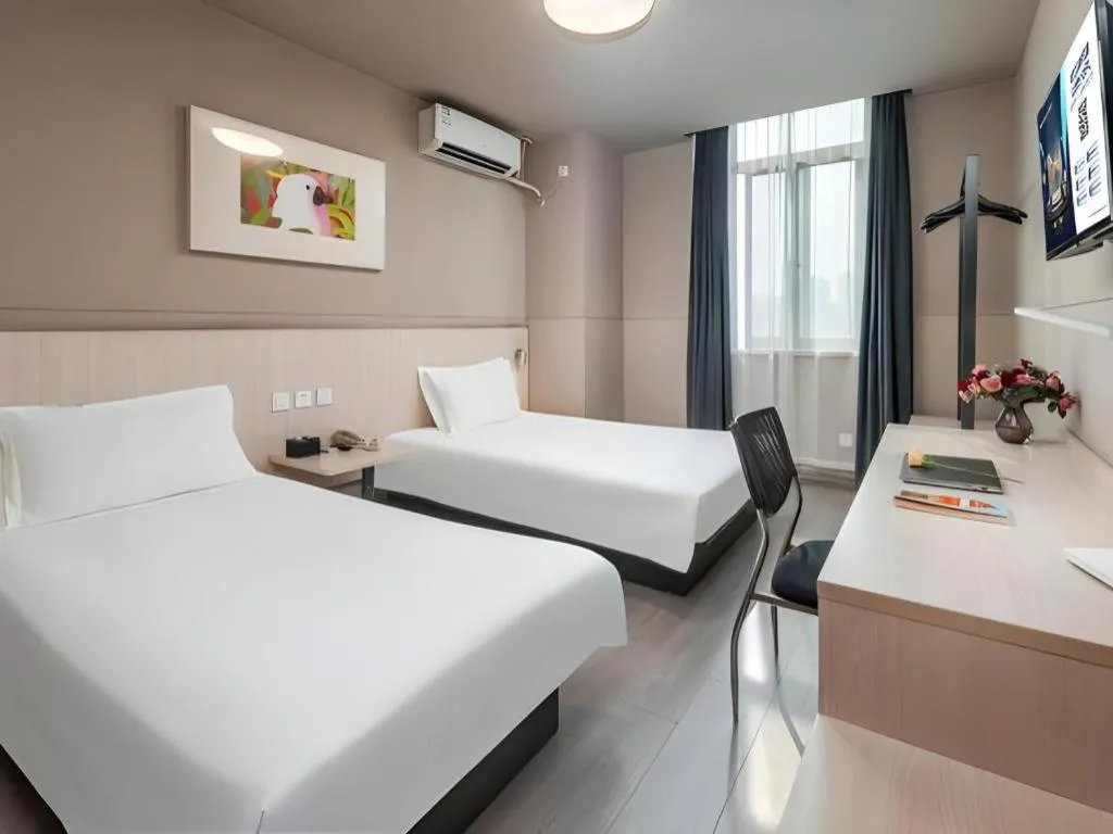 Bed in Jinjiang Inn Changzhou Global Dinosaur City Olympic Center