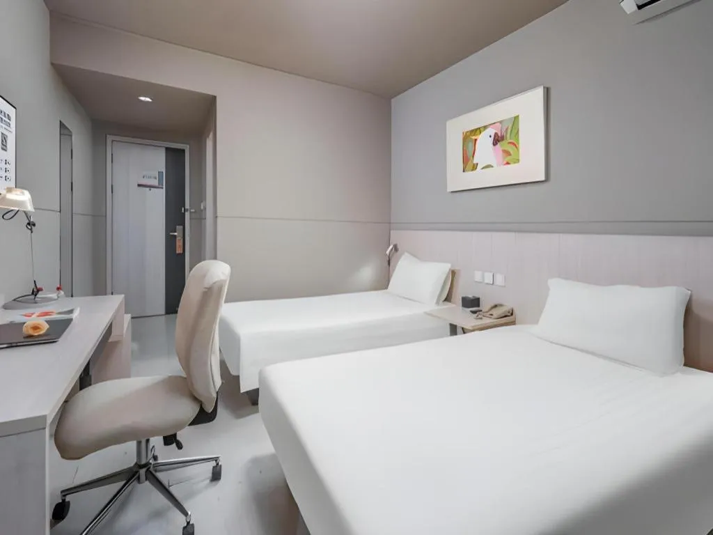 Bed in Jinjiang Inn Changzhou Global Dinosaur City Olympic Center