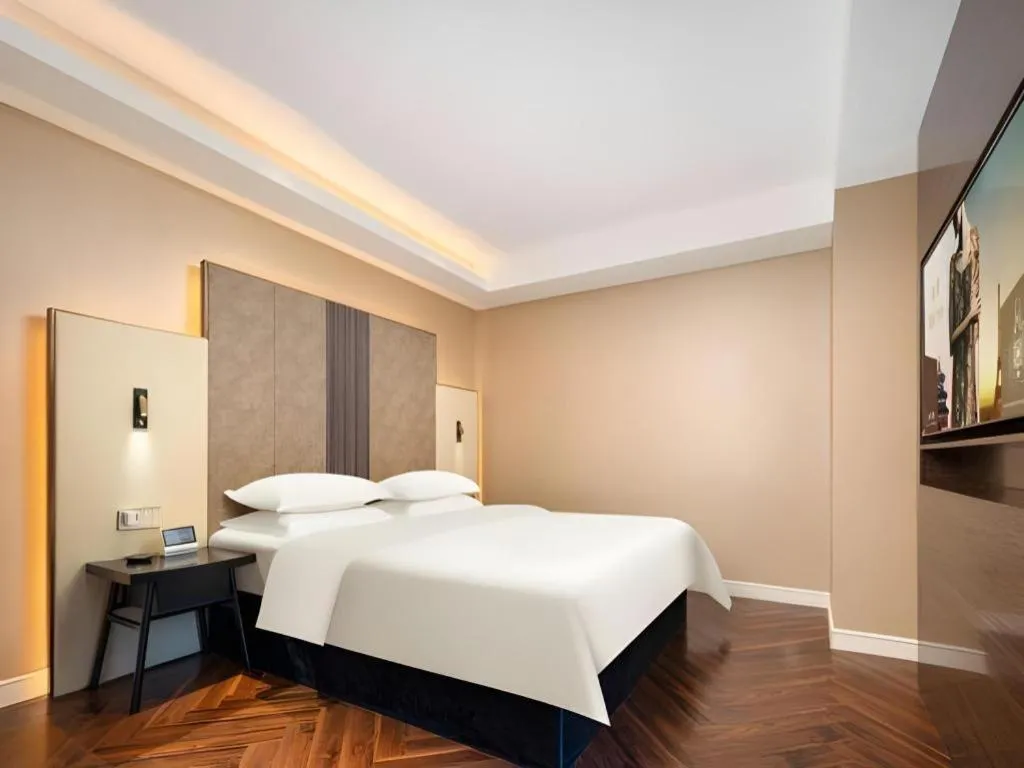 Bed in Jinjiang Metropolo Hotel - Taizhou Wanda Plaza