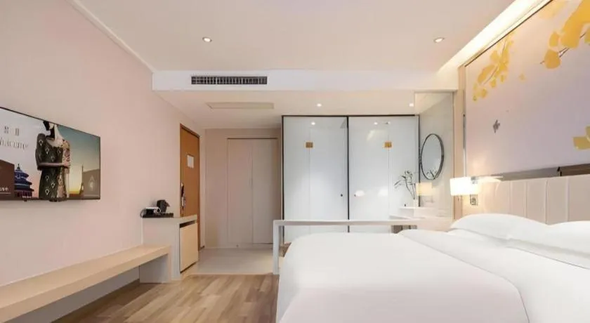 Bed in Jinjiang Metropolo Hotel - Taizhou Wanda Plaza