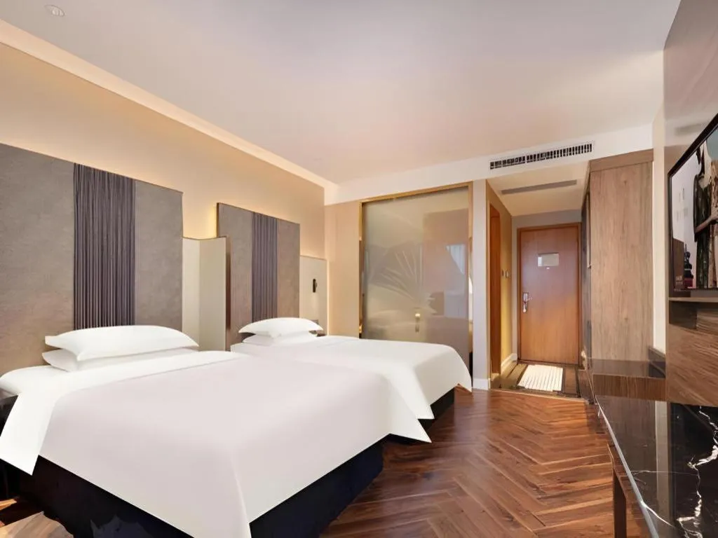 Bed in Jinjiang Metropolo Hotel - Taizhou Wanda Plaza