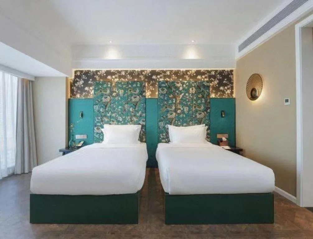 Bed in Jinjiang Metropolo Hotel - Taizhou Wanda Plaza
