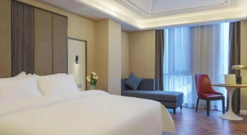 Bed in Jinjiang Metropolo Hotel - Taizhou Wanda Plaza