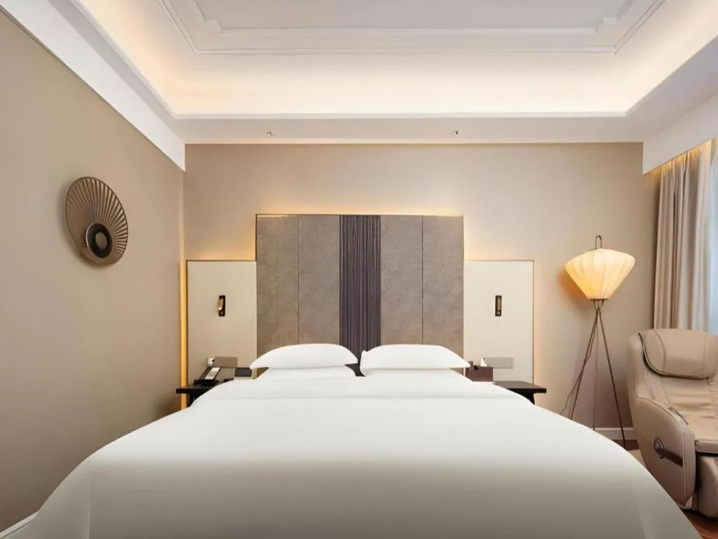 Bed in Jinjiang Metropolo Hotel - Taizhou Wanda Plaza