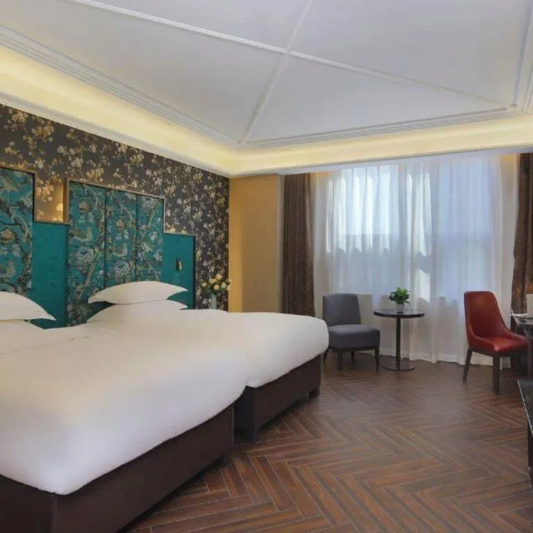 Bed in Jinjiang Metropolo Hotel - Taizhou Wanda Plaza