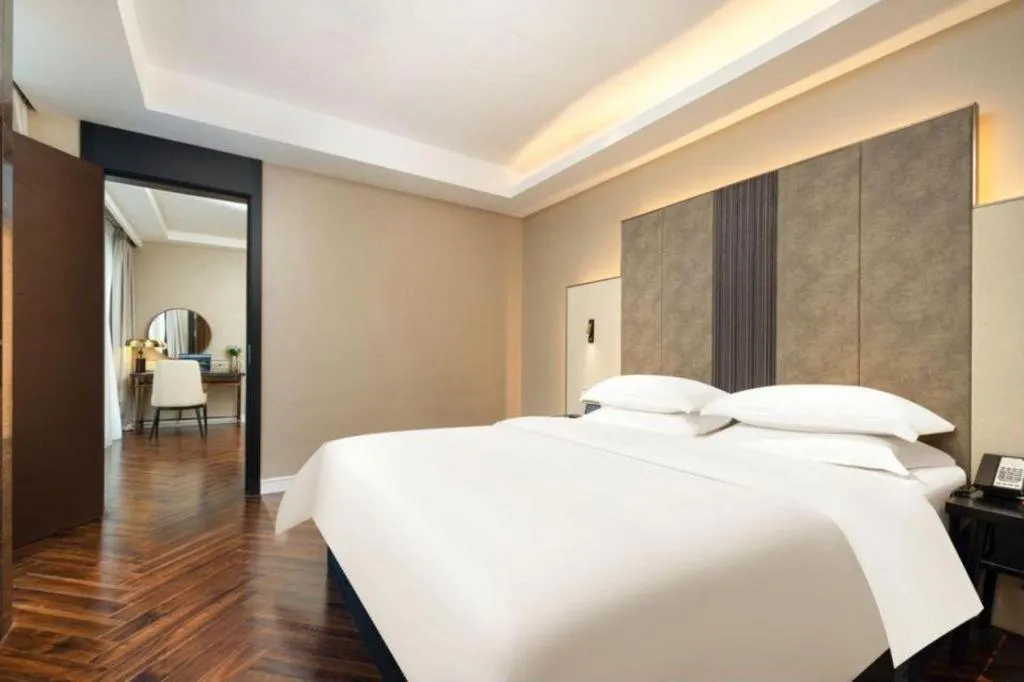 Bed in Jinjiang Metropolo Hotel - Taizhou Wanda Plaza