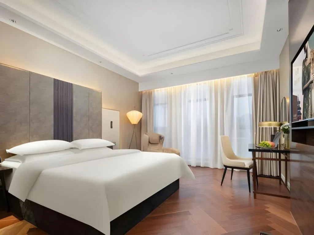 Bed in Jinjiang Metropolo Hotel - Taizhou Wanda Plaza