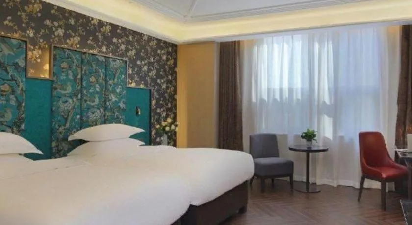 Bed in Jinjiang Metropolo Hotel - Taizhou Wanda Plaza
