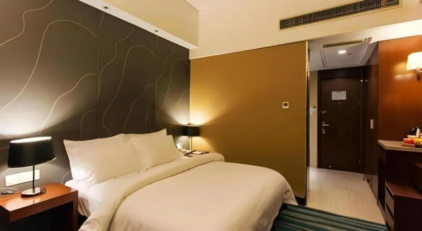 Bed in Metropolo Hotel Shijiazhuang Yuhua Wanda Plaza