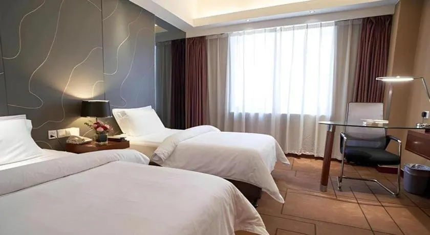 Bed in Metropolo Hotel Shijiazhuang Yuhua Wanda Plaza