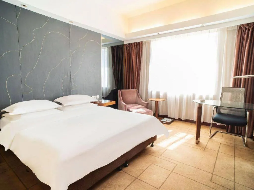 Bed in Metropolo Hotel Shijiazhuang Yuhua Wanda Plaza