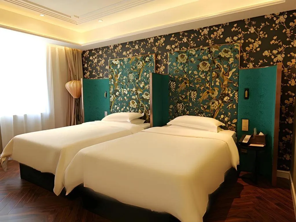 Bed in Metropolo Hotel Shijiazhuang Yuhua Wanda Plaza