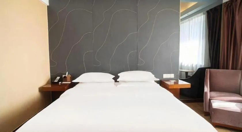 Bed in Metropolo Hotel Shijiazhuang Yuhua Wanda Plaza