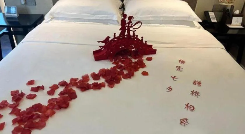 Bed in Metropolo Hotel Shijiazhuang Yuhua Wanda Plaza