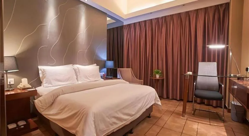 Bed in Metropolo Hotel Shijiazhuang Yuhua Wanda Plaza