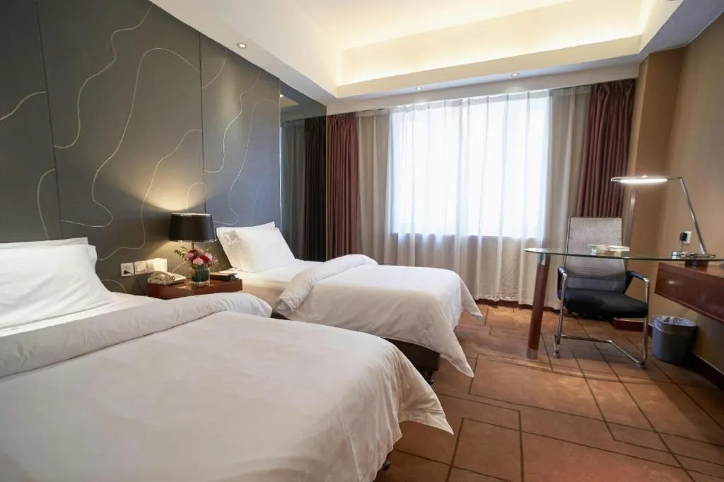 Bed in Metropolo Hotel Shijiazhuang Yuhua Wanda Plaza