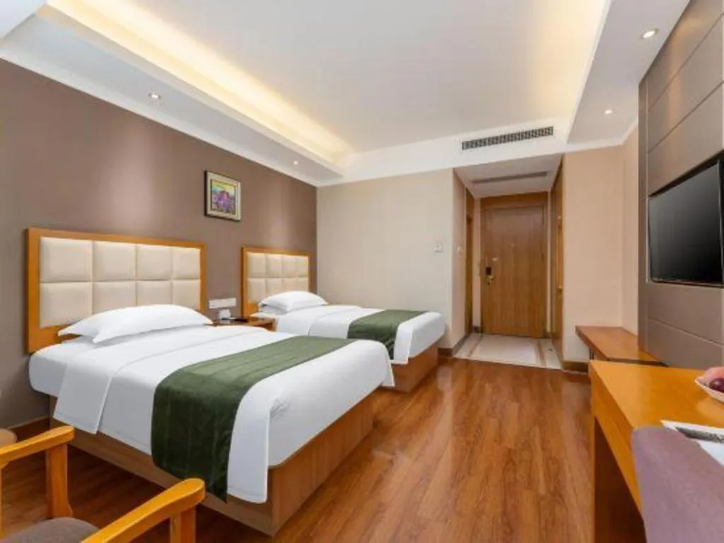 Bed in GreenTree Inn Shandong Taian Feicheng Xincheng Road Business Hotel
