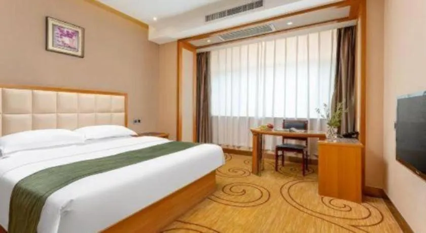 Bed in GreenTree Inn Shandong Taian Feicheng Xincheng Road Business Hotel