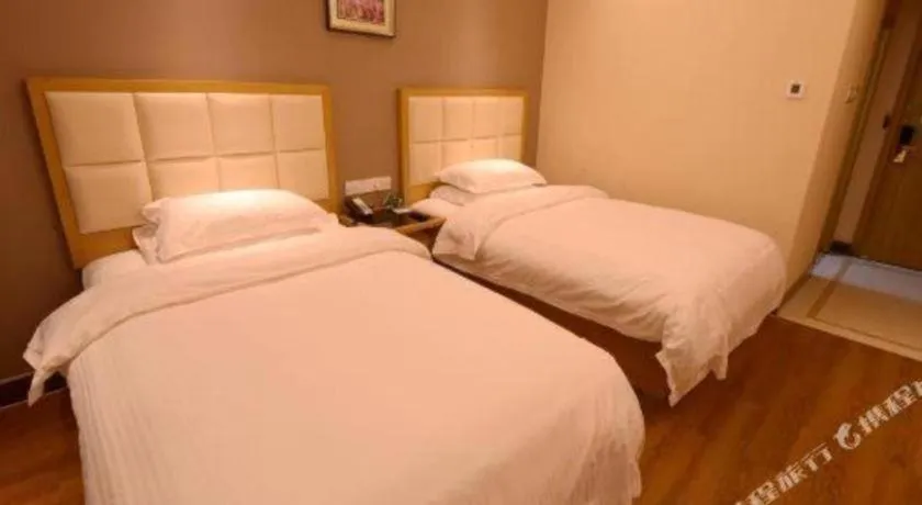 Bed in GreenTree Inn Shandong Taian Feicheng Xincheng Road Business Hotel