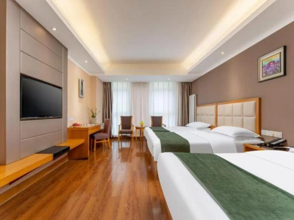 Bed in GreenTree Inn Shandong Taian Feicheng Xincheng Road Business Hotel