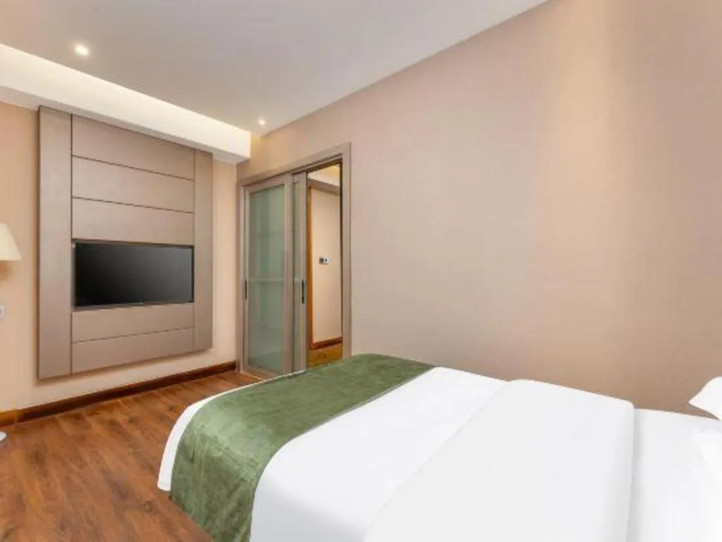 Bed in GreenTree Inn Shandong Taian Feicheng Xincheng Road Business Hotel