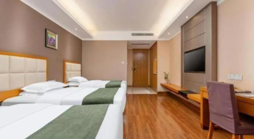 Bed in GreenTree Inn Shandong Taian Feicheng Xincheng Road Business Hotel