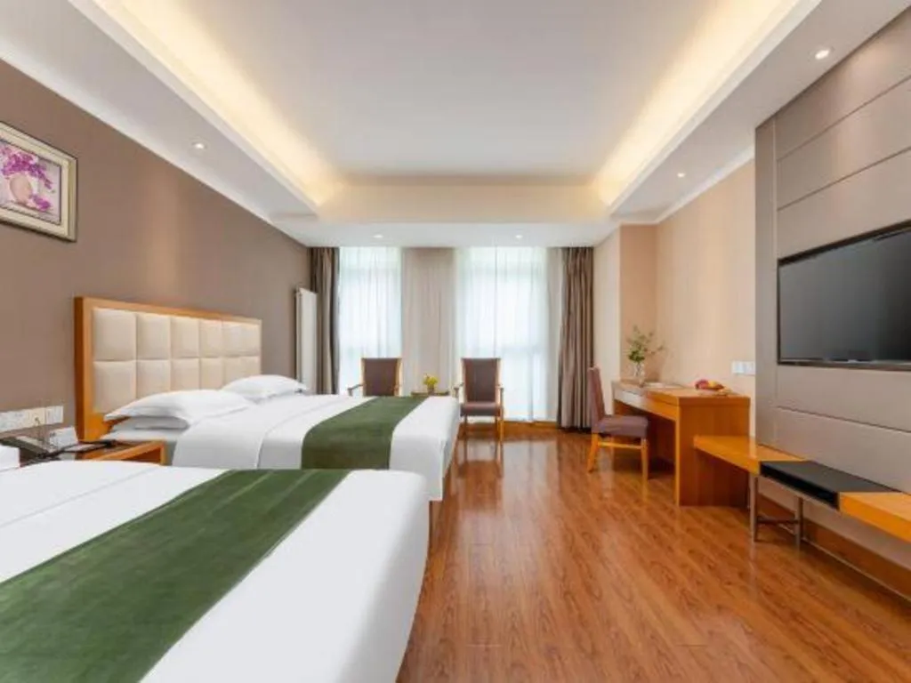 Bed in GreenTree Inn Shandong Taian Feicheng Xincheng Road Business Hotel
