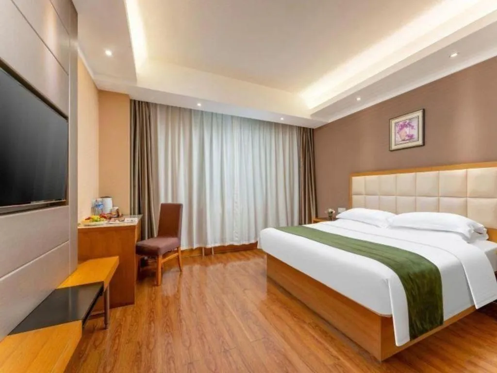 Bed in GreenTree Inn Shandong Taian Feicheng Xincheng Road Business Hotel