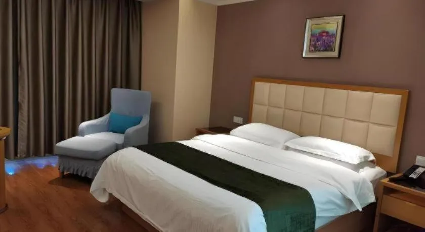 Bed in GreenTree Inn Shandong Taian Feicheng Xincheng Road Business Hotel