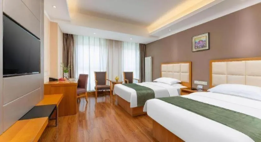 Bed in GreenTree Inn Shandong Taian Feicheng Xincheng Road Business Hotel