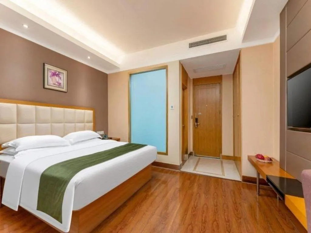 Bed in GreenTree Inn Shandong Taian Feicheng Xincheng Road Business Hotel
