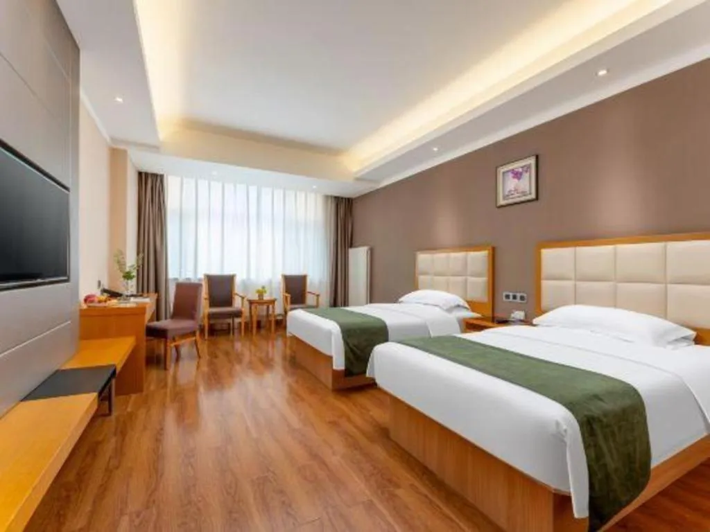 Bed in GreenTree Inn Shandong Taian Feicheng Xincheng Road Business Hotel