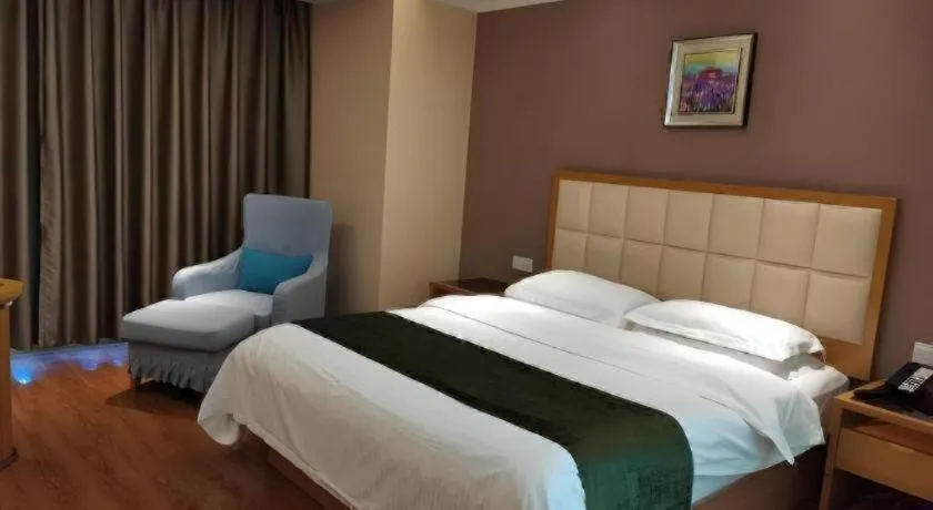 Bed in GreenTree Inn Shandong Taian Feicheng Xincheng Road Business Hotel