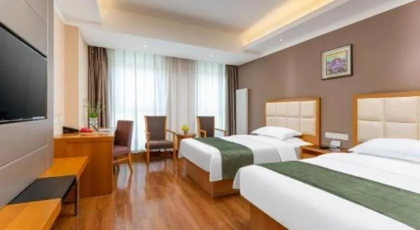 Bed in GreenTree Inn Shandong Taian Feicheng Xincheng Road Business Hotel