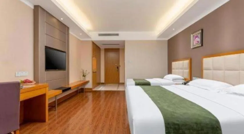 Bed in GreenTree Inn Shandong Taian Feicheng Xincheng Road Business Hotel