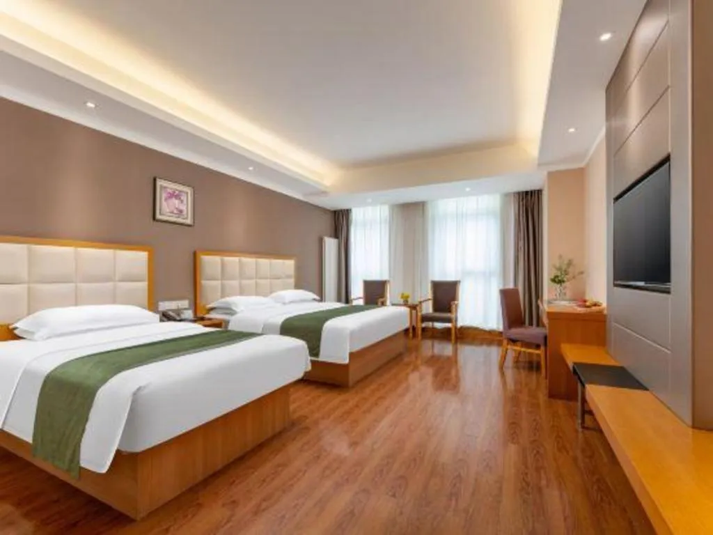 Bed in GreenTree Inn Shandong Taian Feicheng Xincheng Road Business Hotel