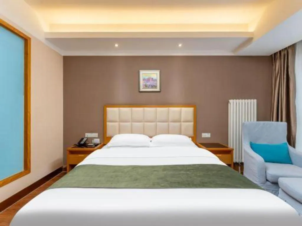 Bed in GreenTree Inn Shandong Taian Feicheng Xincheng Road Business Hotel
